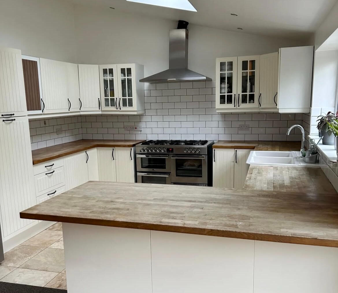 Before kitchen painting – original cream shaker kitchen before transformation by Wilkinson Specialist Sprays.
