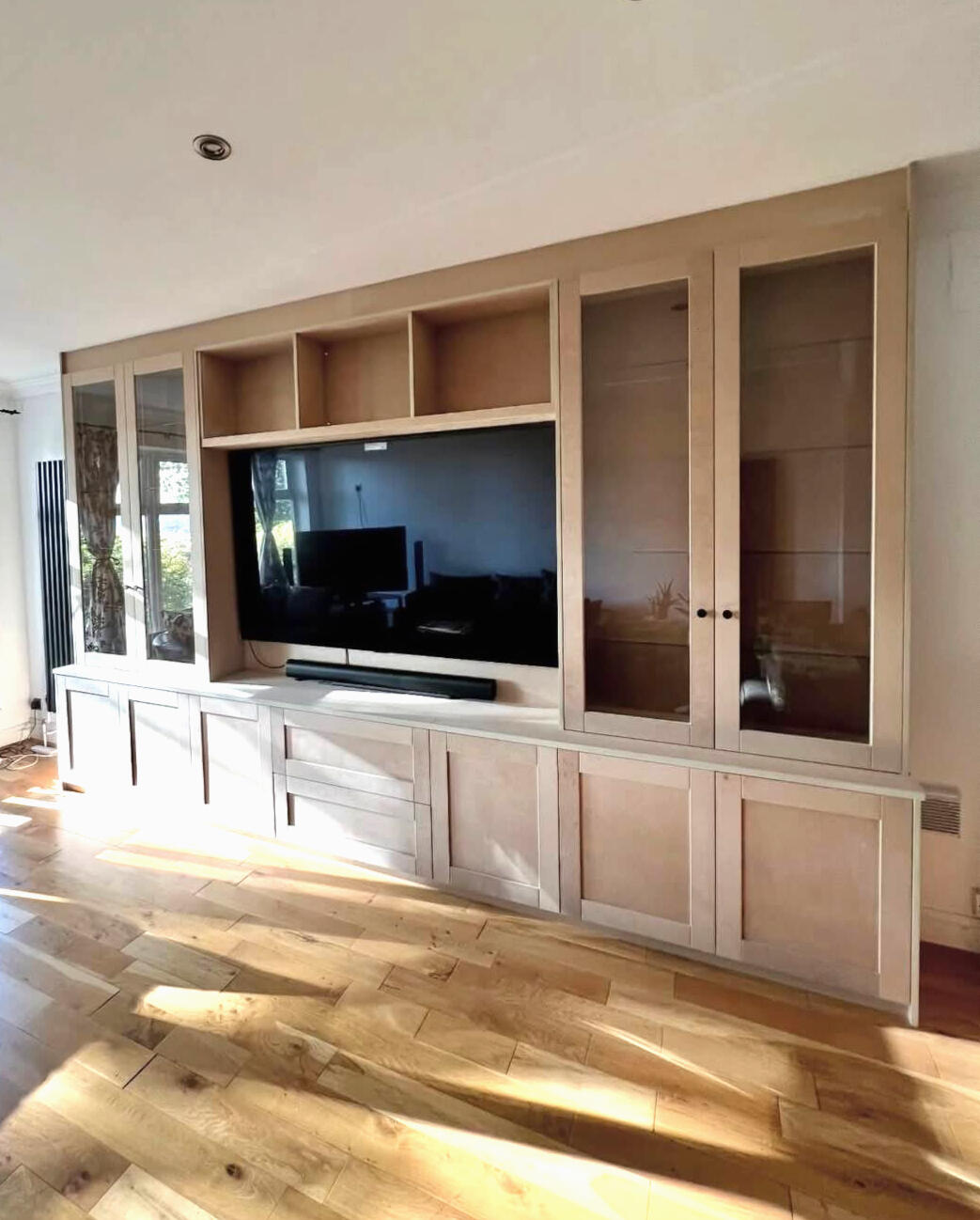 MDF fitted media wall before professional furniture spraying and colour change in Tettenhall.