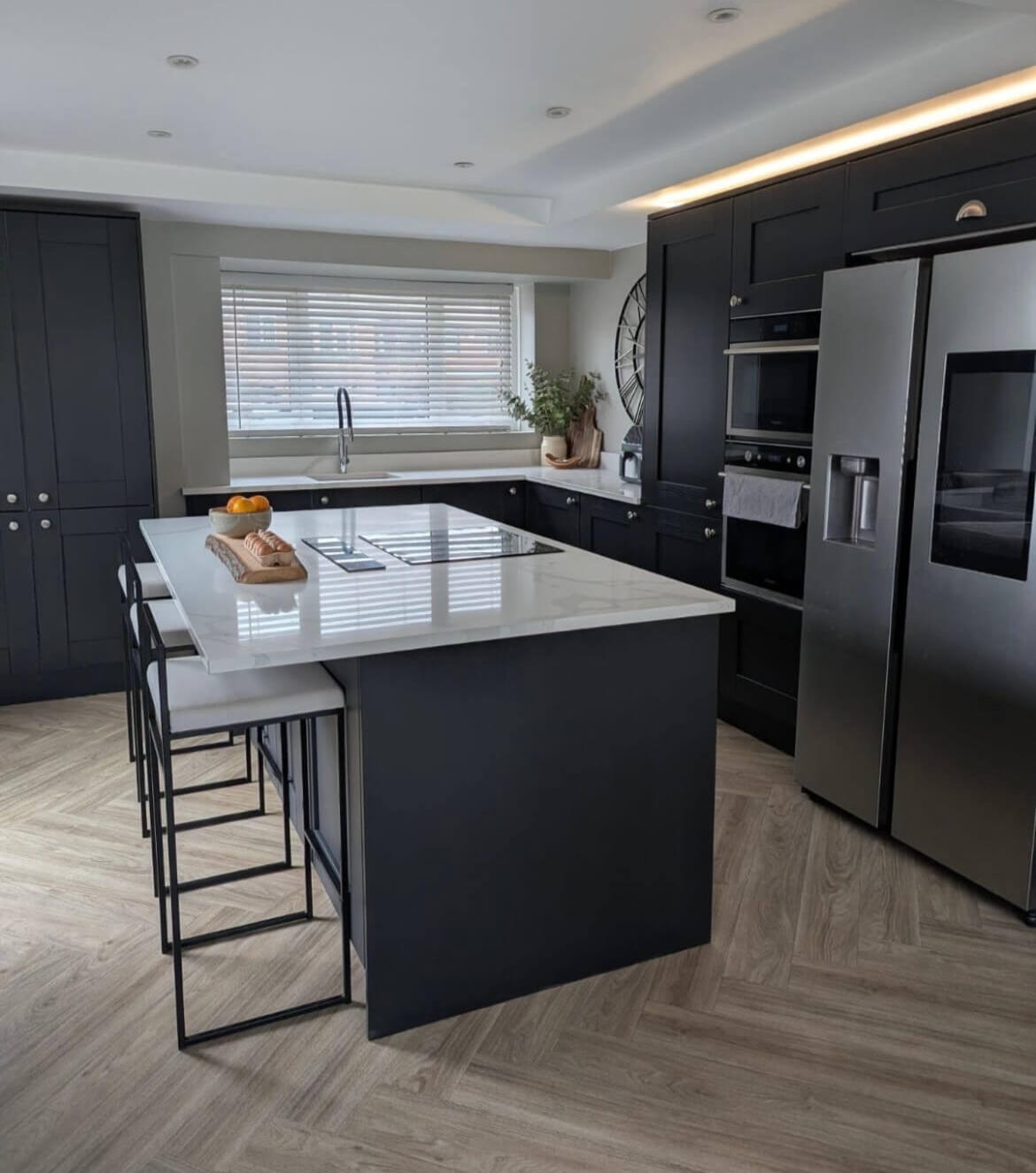 Dark charcoal shaker kitchen professionally hand painted by Wilkinson Specialist Sprays, transforming a modern kitchen in Wombourne.