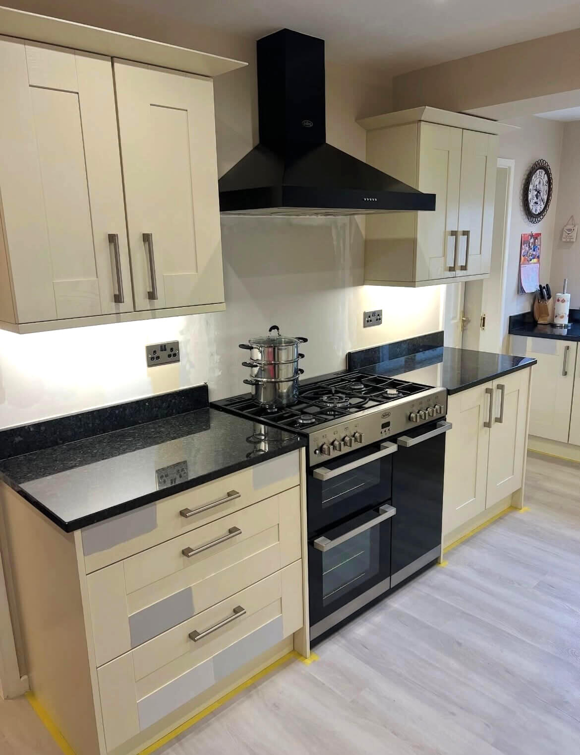 Cream shaker kitchen before professional kitchen cabinet repainting by Wilkinson Specialist Sprays in Wombourne.