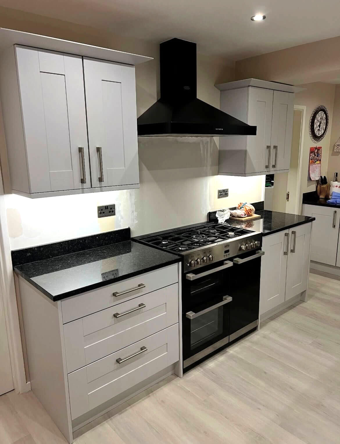Warm light grey shaker kitchen after specialist cabinet painting by Wilkinson Specialist Sprays, creating a modern, durable finish in Wombourne.