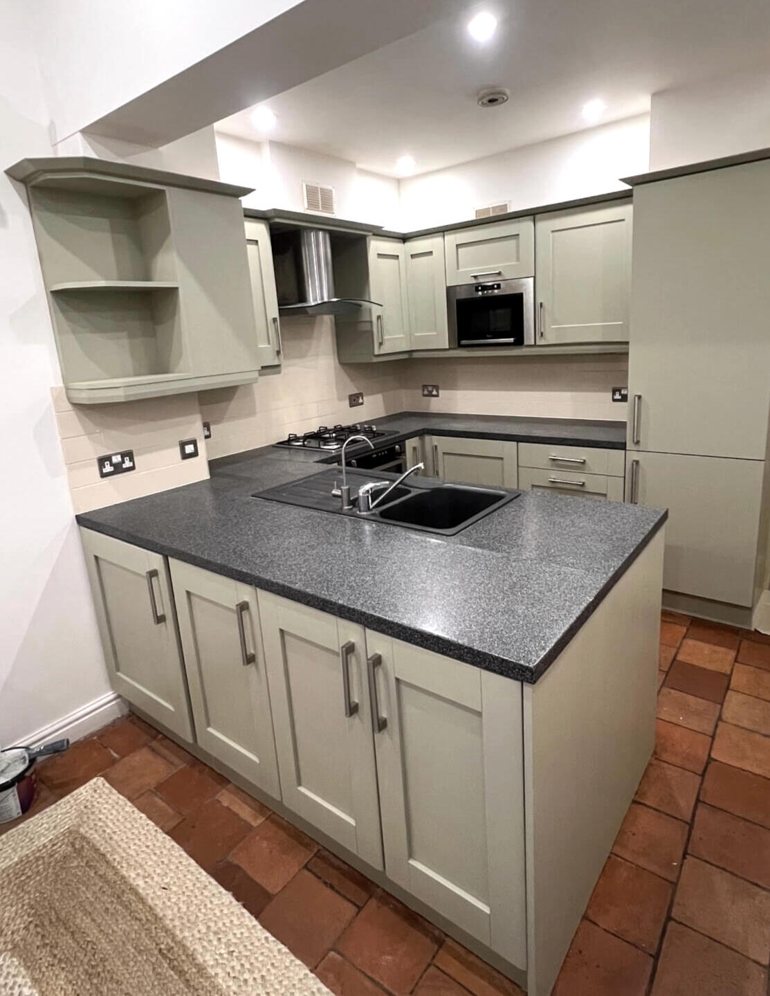 Beautiful sage green kitchen transformation with professionally hand painted cabinets in Bridgnorth.