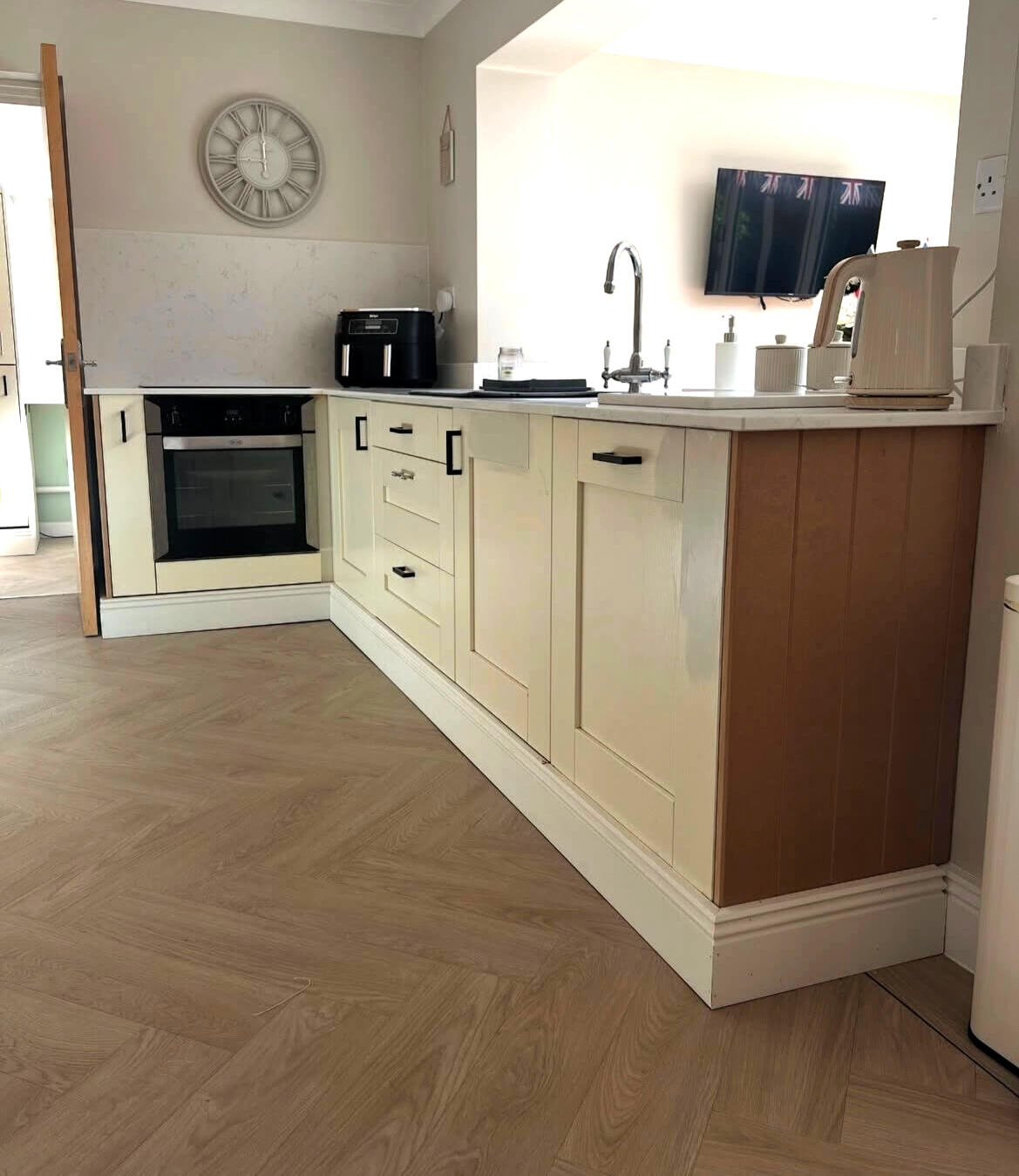 Traditional cream shaker kitchen before cabinet repainting by Wilkinson Specialist Sprays in Wombourne.